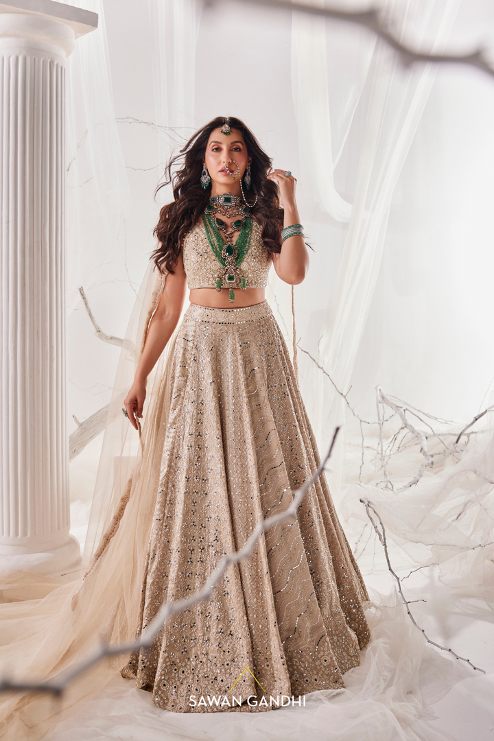 Nora Fatehi in Gold beige beadwork lehenga