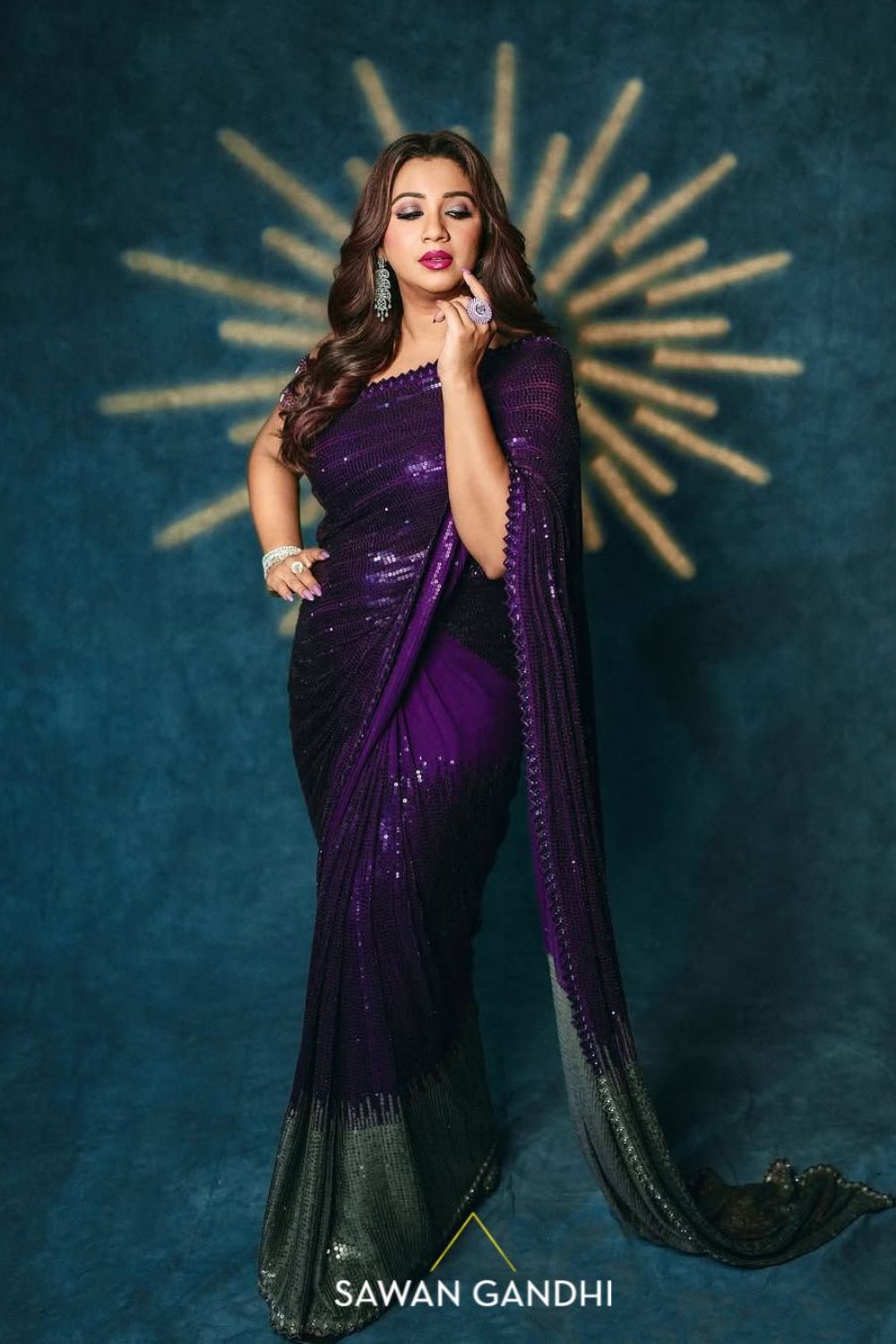 Shreya Ghosal in Wine to grey sequin saree