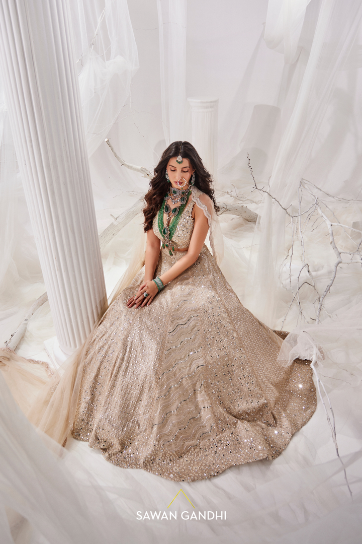 Nora Fatehi in Gold beige beadwork lehenga
