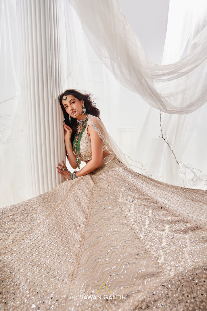 Nora Fatehi in Gold beige beadwork lehenga