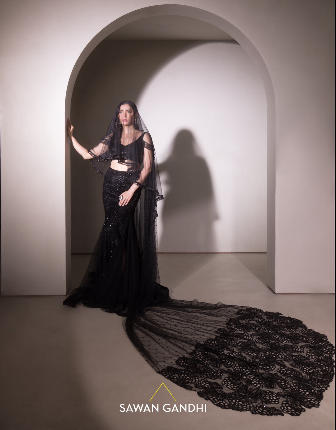 Mahira Khan in Black crystal work fish cut drape skirt set