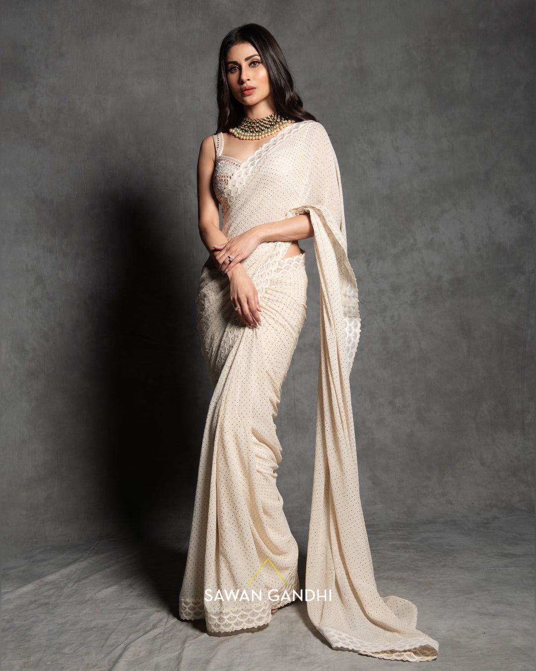 Mouni Roy in Ivory mukaish work saree